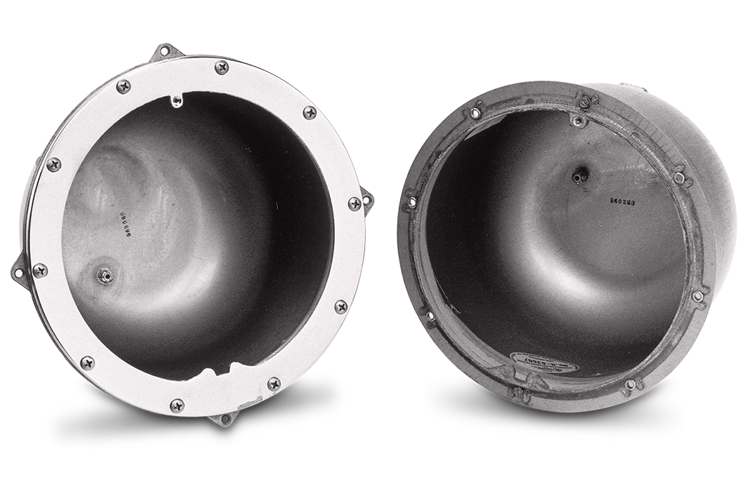Two hemispherical metal objects with bolts around the rims, positioned side by side against a plain background, feature Pentair Small Stainless Steel Niches by Pentair Pool for added detail.