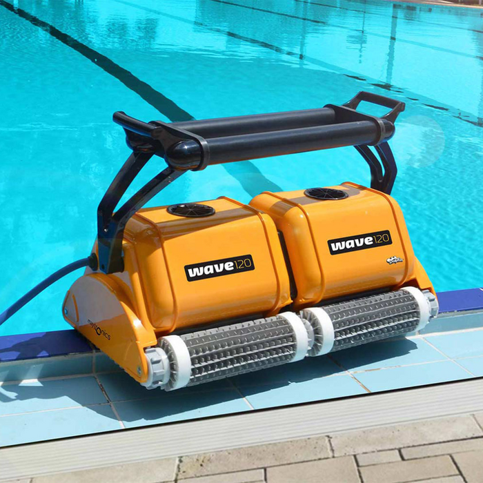 The Maytronics Dolphin Wave 120 Commercial Robotic Pool Cleaner 9999359-W120, a pinnacle of pool maintenance, rests serenely at the edge of the sparkling swimming pool.