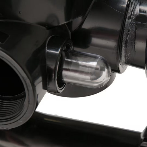 Close-up of a black mechanical device with a transparent cylindrical component and a visible threaded opening, resembling the Hayward SP0715X62 Vari-Flo Side Mount Multiport Valve with 2" ports, used in sand filters by Hayward.